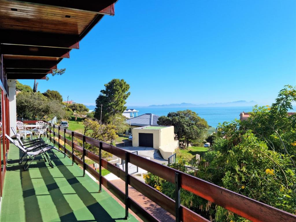 a balcony of a house with a view of the ocean at 'The Loft', 2 bedroom, sleeps 4, Central, Fantastic Views! in Cape Town