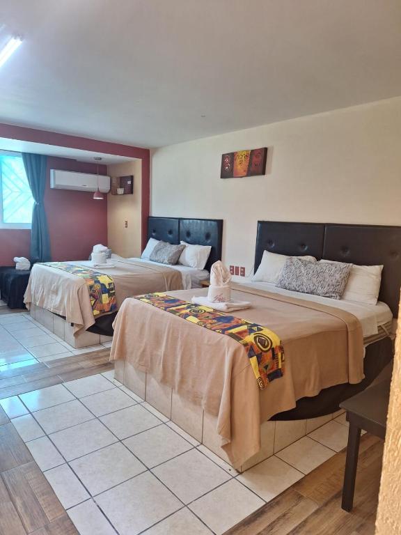 Postel nebo postele na pokoji v ubytování Hotel San Rafael