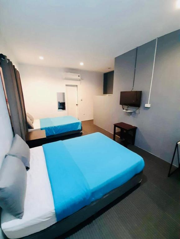 Postel nebo postele na pokoji v ubytování Hometown Hotel - Lacson Bacolod