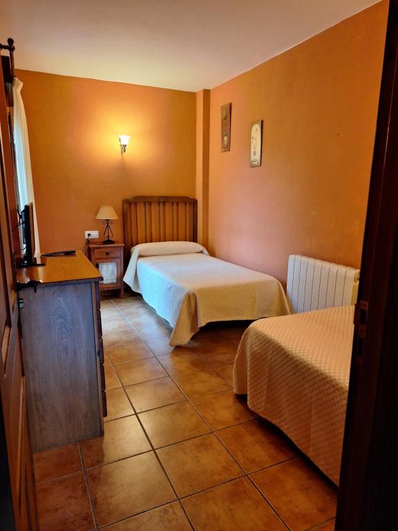 Postel nebo postele na pokoji v ubytování Hotel Rural Valle del Tuejar