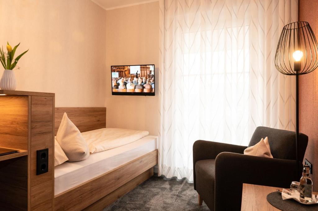 Postel nebo postele na pokoji v ubytování Hotel Pieper-Kersten