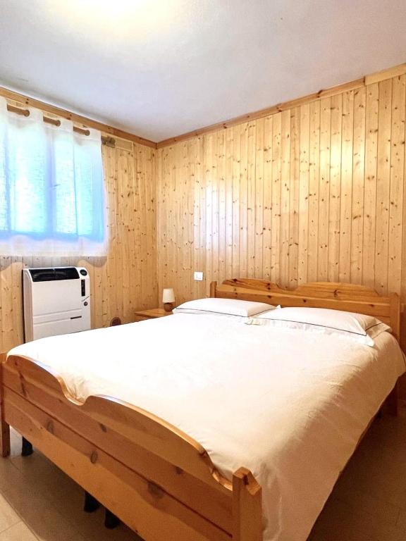 Postel nebo postele na pokoji v ubytování Casa Fiocco di Neve