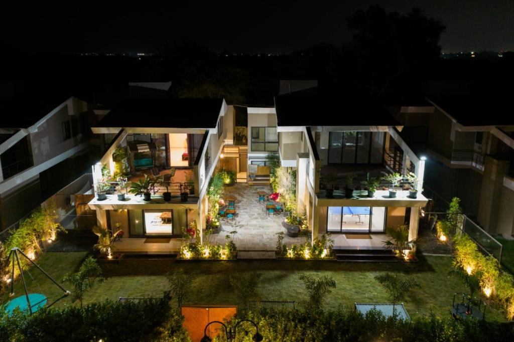 an aerial view of a house at night at The Sloppy House in Indore