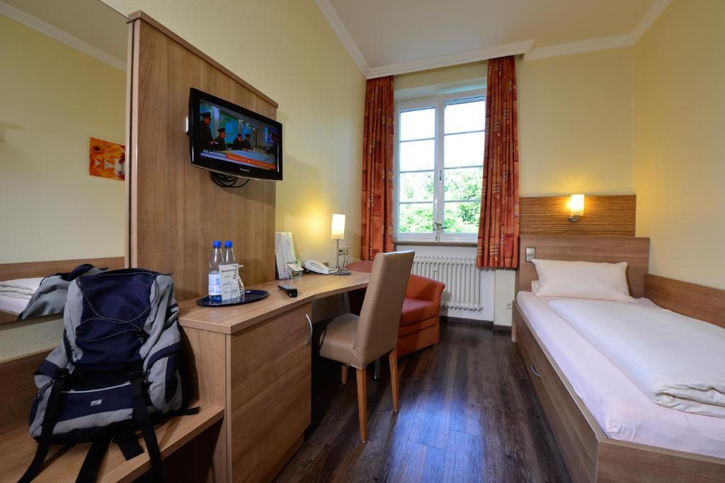 Postel nebo postele na pokoji v ubytování Haus Neugebauer-Gästehaus Garni