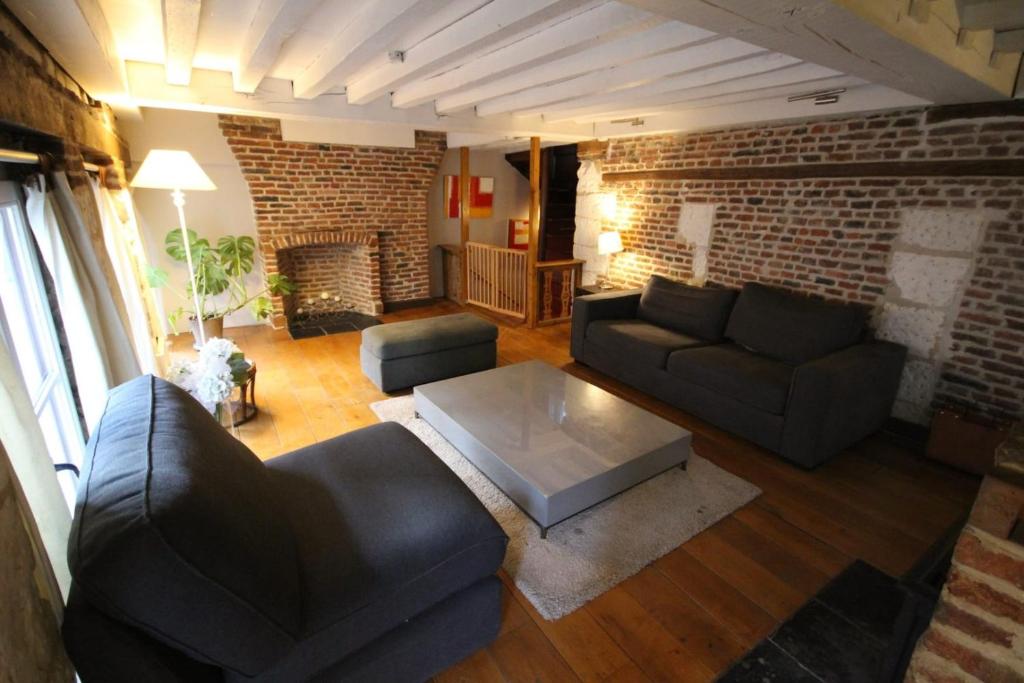 a living room with a couch and a coffee table at Old Town - Lovely typical house in Lille