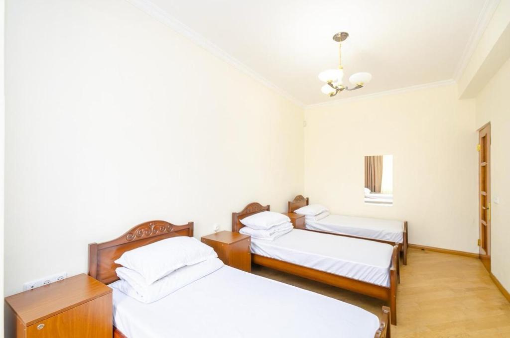 Postel nebo postele na pokoji v ubytování Areva Hostel & Apartment