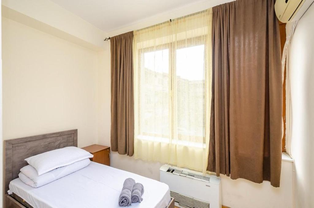 Postel nebo postele na pokoji v ubytování Areva Hostel & Apartment