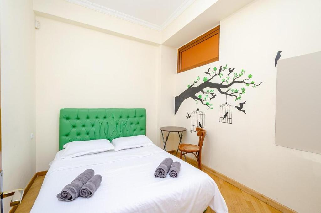 Postel nebo postele na pokoji v ubytování Areva Hostel & Apartment