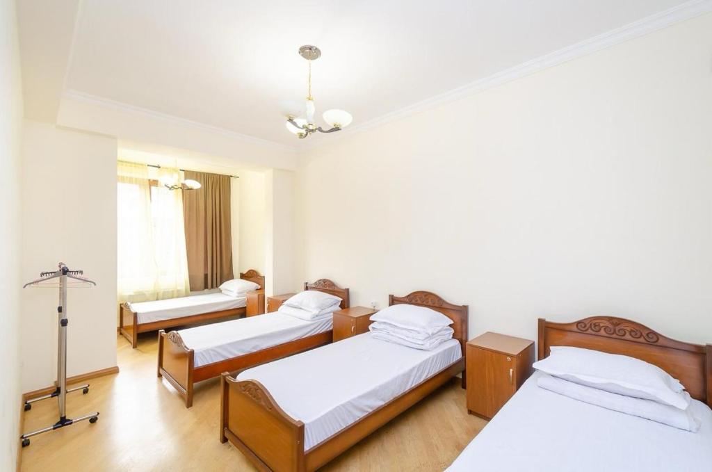 Postel nebo postele na pokoji v ubytování Areva Hostel & Apartment