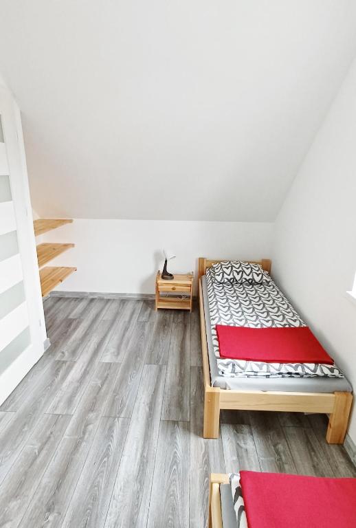 Postel nebo postele na pokoji v ubytování Domki 7 Houses Rewal