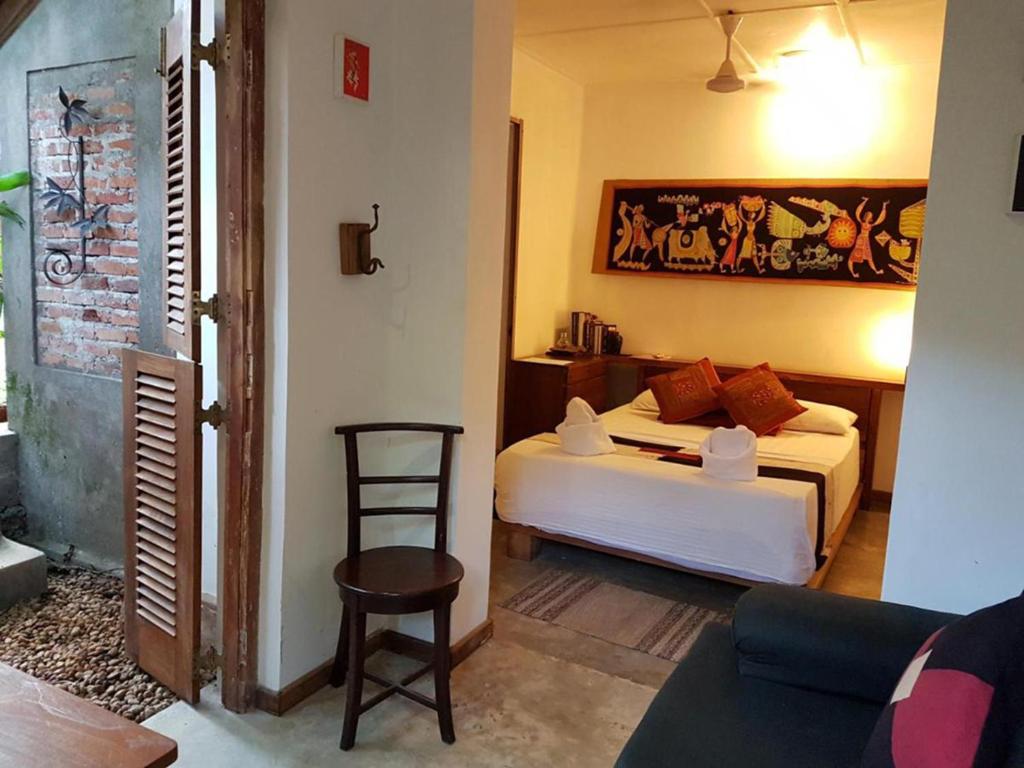 Postel nebo postele na pokoji v ubytování Highbury Colombo