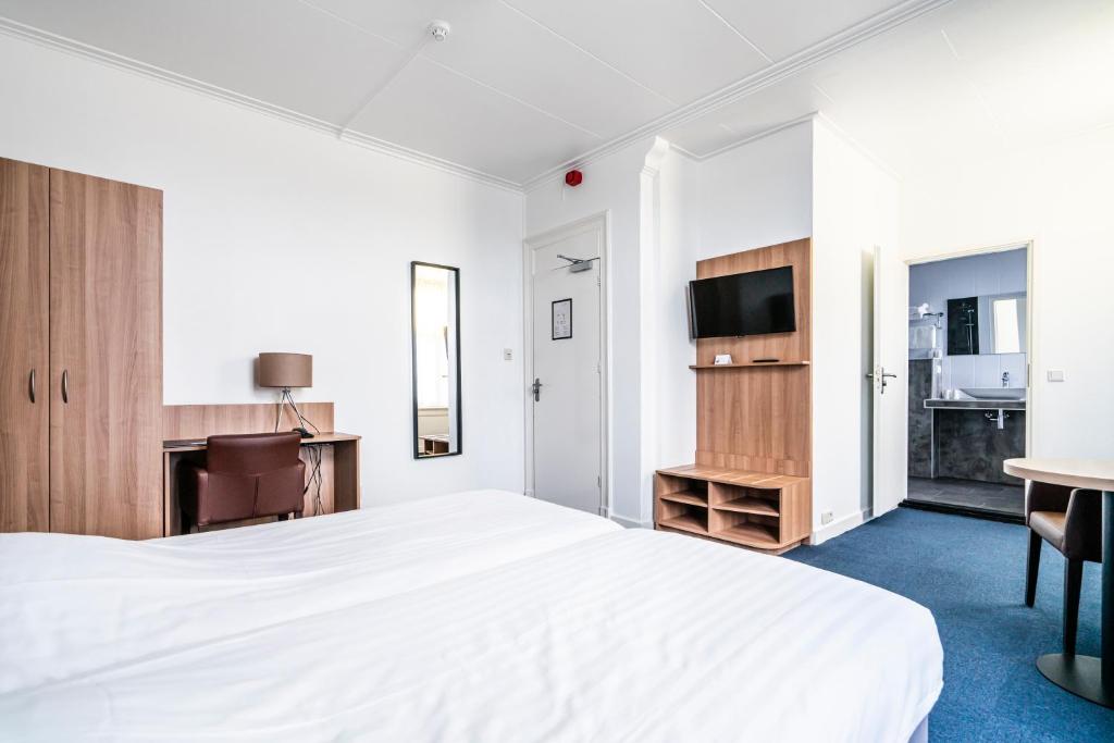 Postel nebo postele na pokoji v ubytování Hotel Hulst