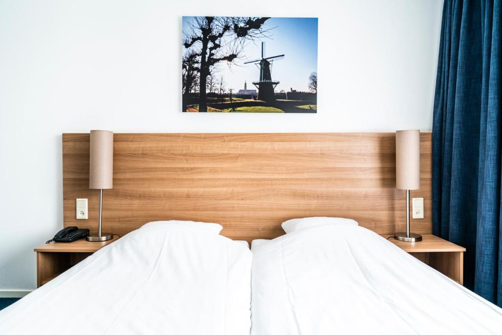 Postel nebo postele na pokoji v ubytování Hotel Hulst