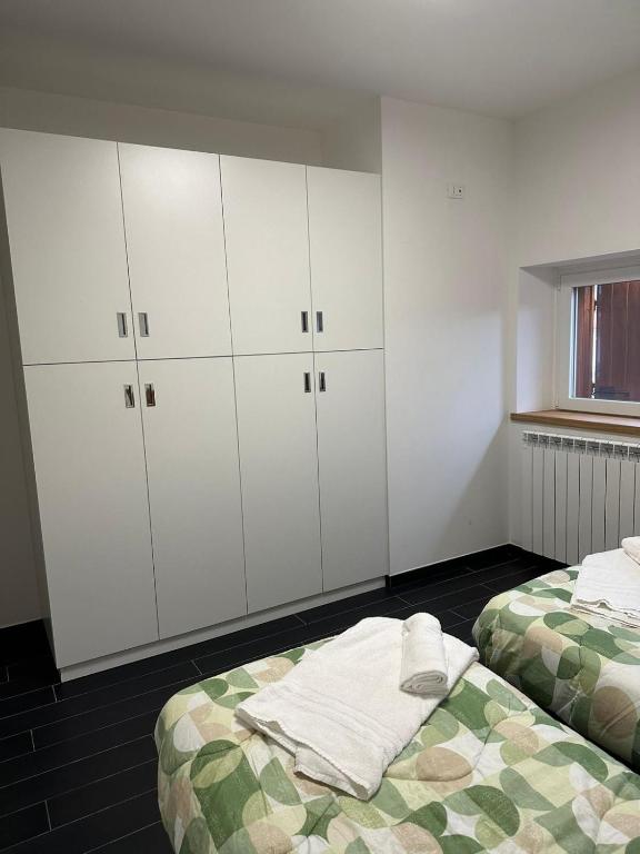 A bed or beds in a room at La corte dell'ulivo