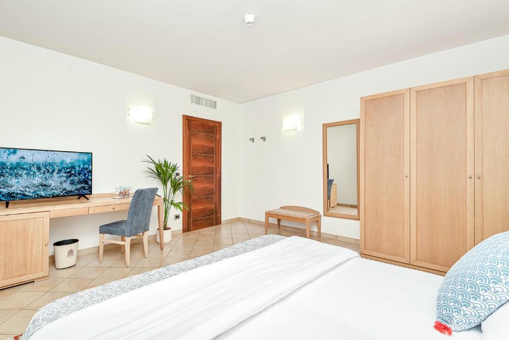 Ein Bett oder Betten in einem Zimmer der Unterkunft Park Hotel Argento