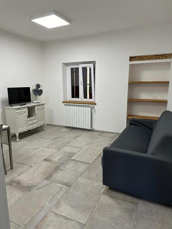 A television and/or entertainment centre at La corte dell'ulivo