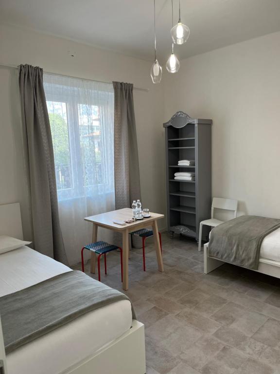 Postel nebo postele na pokoji v ubytování FLORA