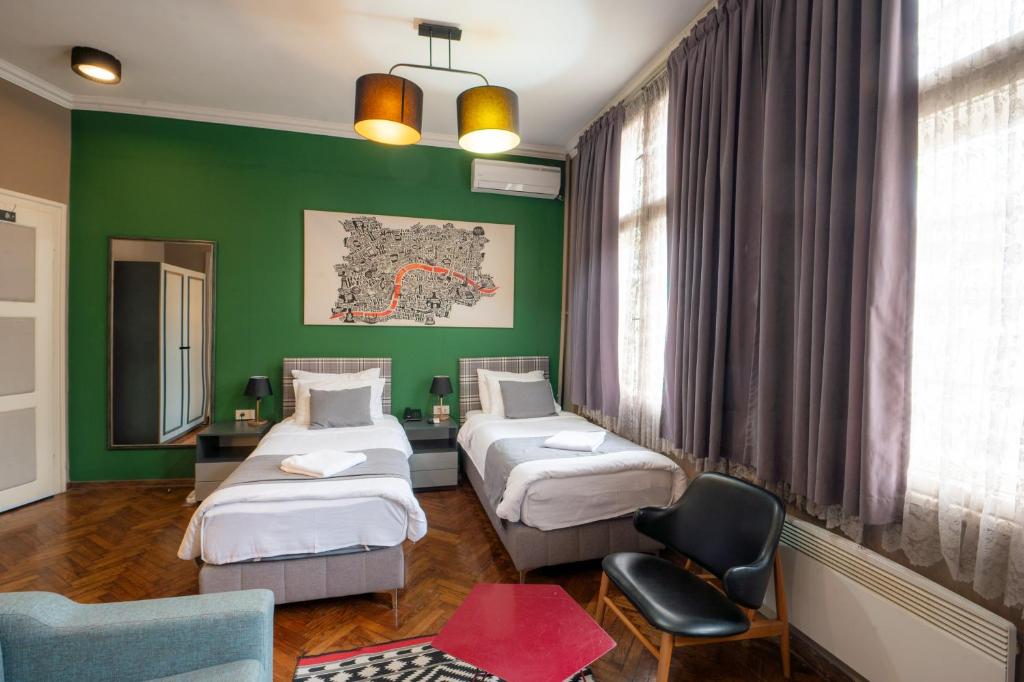 Postel nebo postele na pokoji v ubytování Hotel London B&B