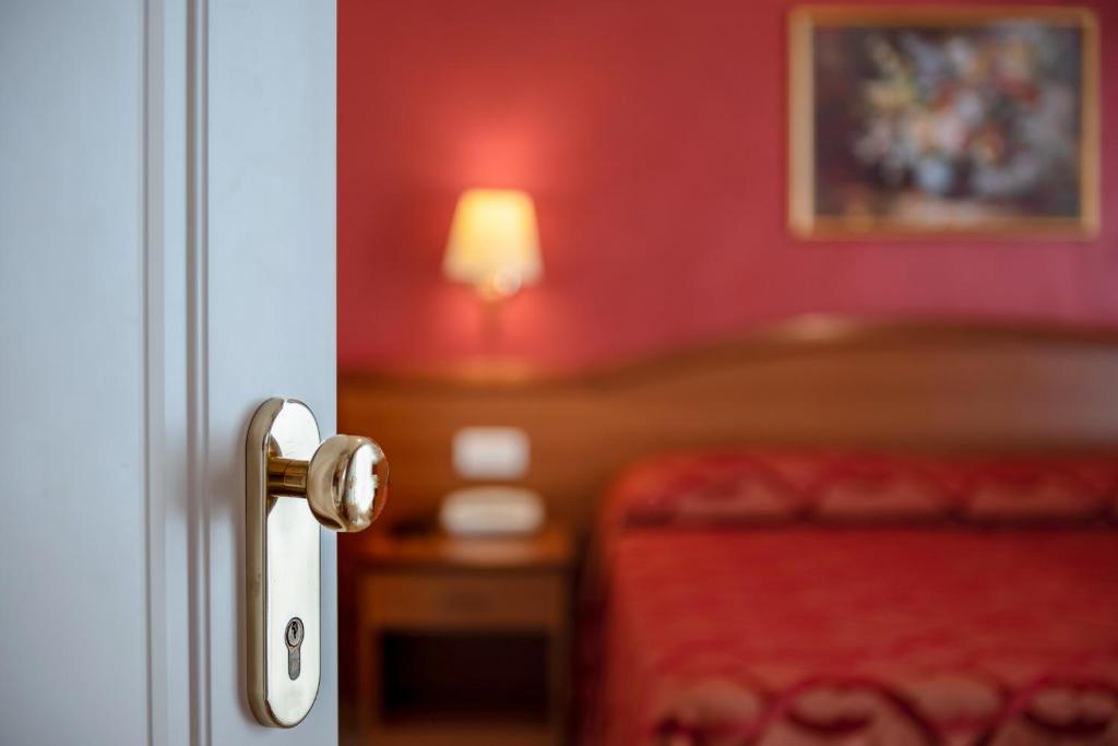 Postel nebo postele na pokoji v ubytování Hotel Tiffany