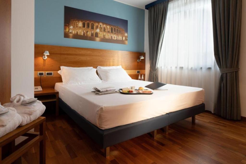 Postel nebo postele na pokoji v ubytování Best Western Hotel Fiera Verona