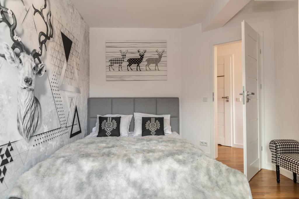 Posteľ alebo postele v izbe v ubytovaní TatryTop Apartamenty Szymaszkowa Ski Premium
