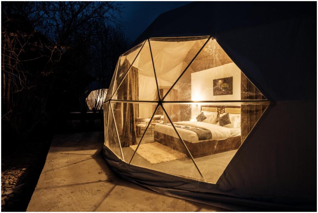 a room with a bed inside of a tent at The Crystal Resort in Hundar
