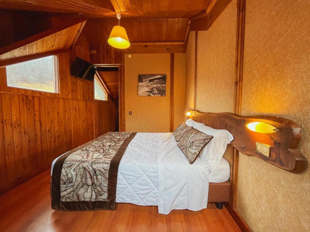 Postel nebo postele na pokoji v ubytování Hotel Togo Monte Terminillo