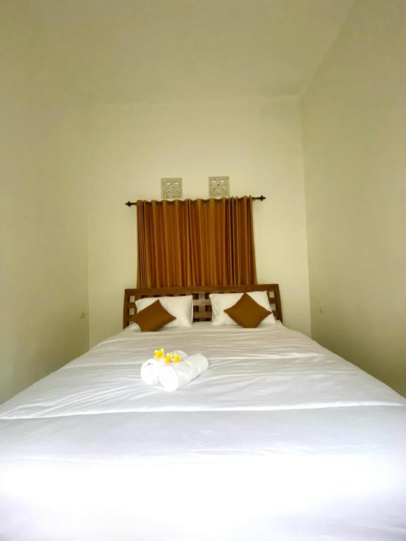 Postel nebo postele na pokoji v ubytování Kopi Bali House With Private Pool