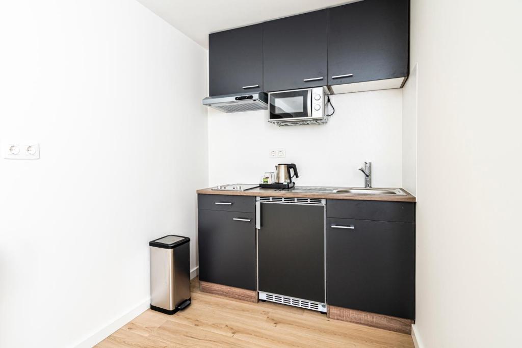 Kuchyň nebo kuchyňský kout v ubytování Hotel Hulst