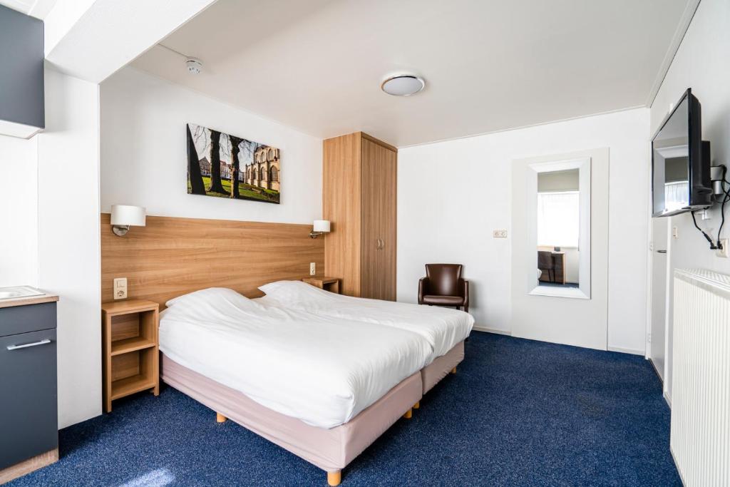 Postel nebo postele na pokoji v ubytování Hotel Hulst