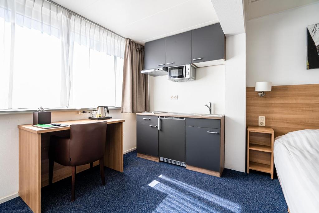 Kuchyň nebo kuchyňský kout v ubytování Hotel Hulst