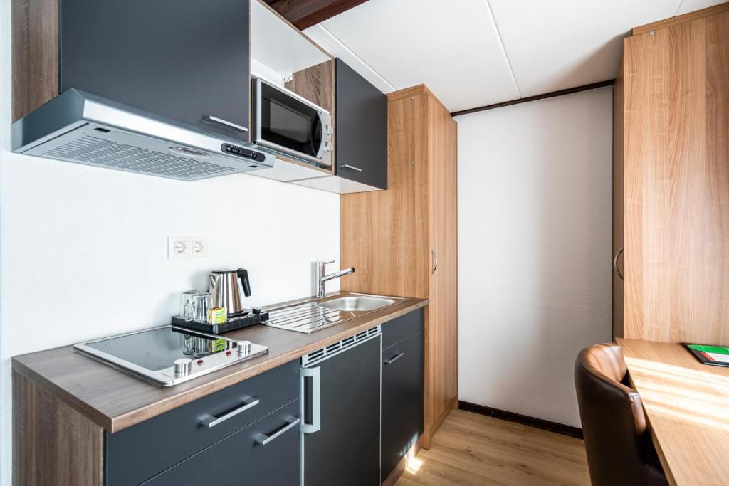 Kuchyň nebo kuchyňský kout v ubytování Hotel Hulst