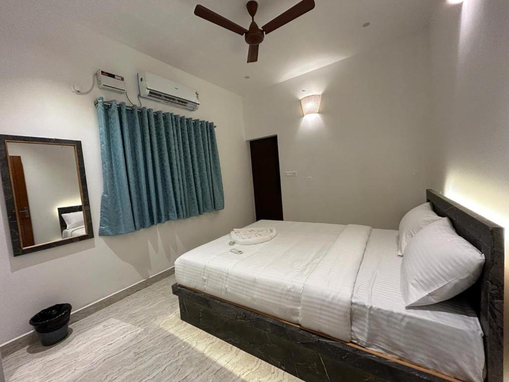 Cama o camas de una habitación en La Tamara Auroville