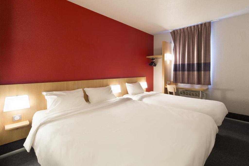 Postel nebo postele na pokoji v ubytování B&B HOTEL Perpignan Sud Marché International