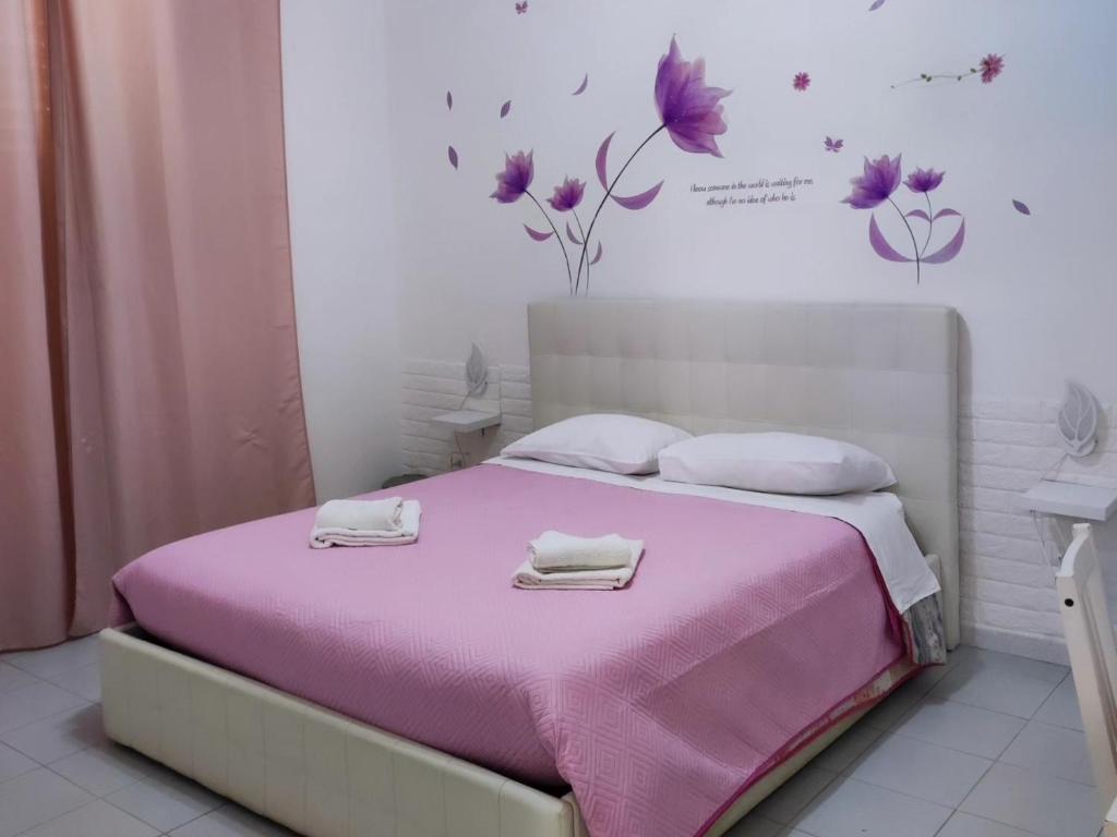 Una cama o camas en una habitación de Le tre orchidee