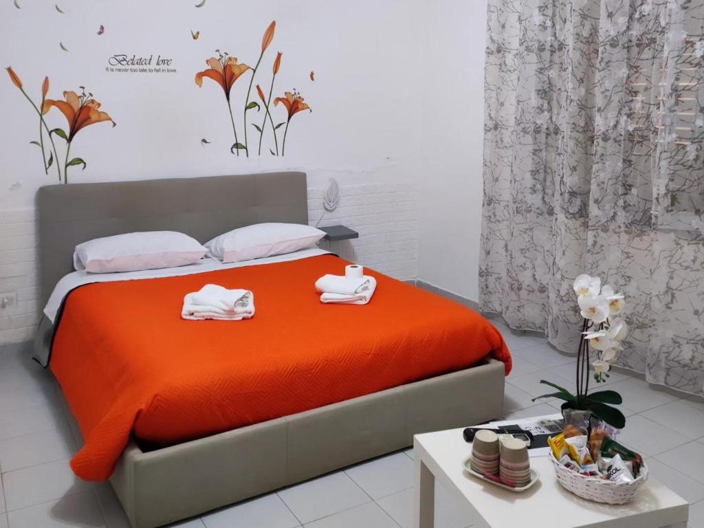 Una cama o camas en una habitación de Le tre orchidee
