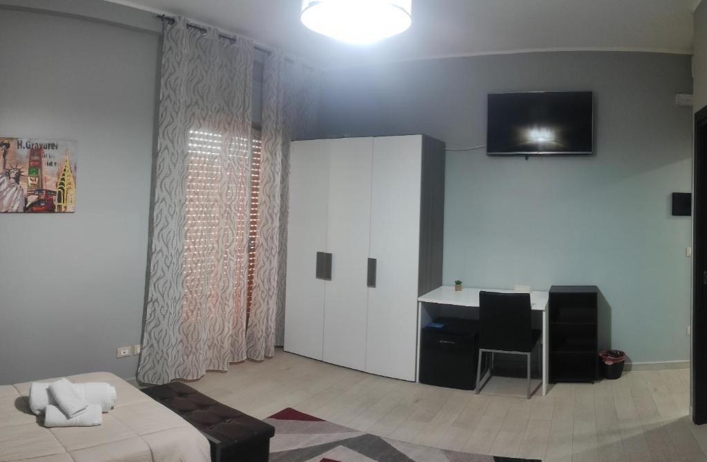 TV a/nebo společenská místnost v ubytování Guest House Elettra