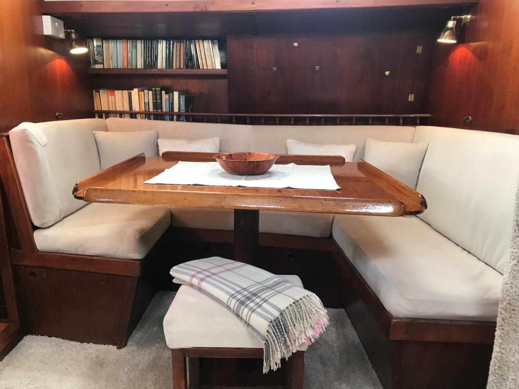 a table in a boat with a bowl on it at Marina Oasis, Your Boatel in Puerto Calero