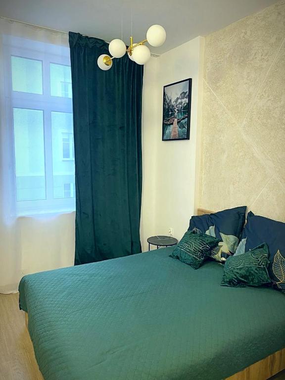 Łóżko lub łóżka w pokoju w obiekcie MH Apartments Centrum
