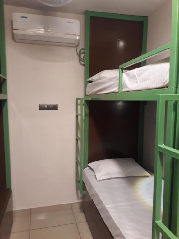 a bunk bed room with two bunk beds in it at CosyCove in Ernakulam