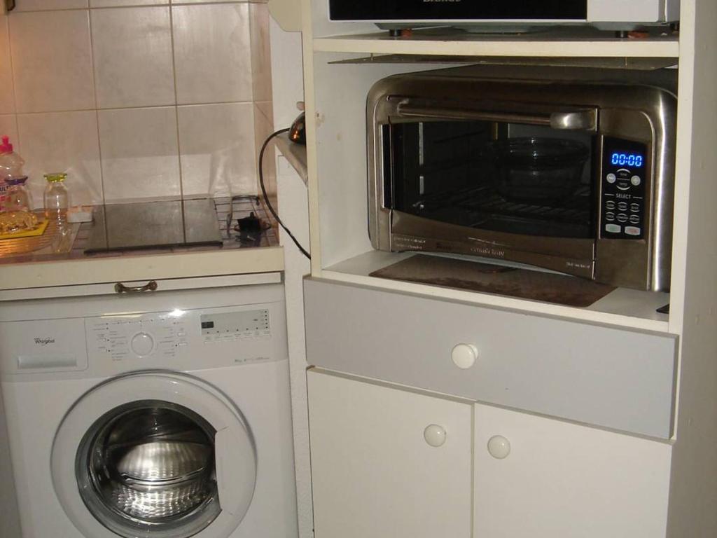 Kuchyňa alebo kuchynka v ubytovaní Appartement 2P climatisé avec loggia et garage - Balaruc-les-Bains - FR-1-680-12
