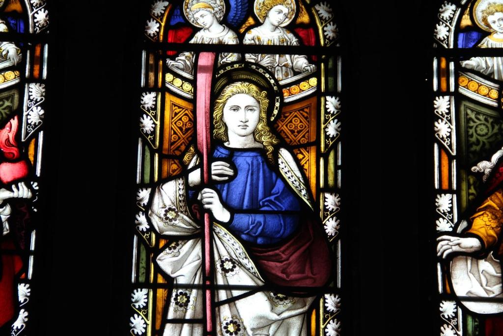 a stained glass window of a woman holding a sword at Pintail Apartment Bamburgh in Bamburgh