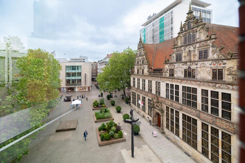 a view of a street in a city with buildings at numa l Saga Apartments in Bremen