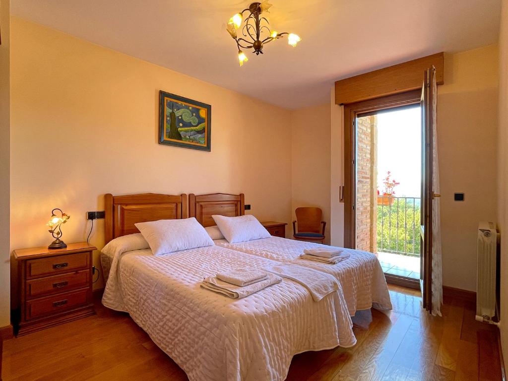 Postel nebo postele na pokoji v ubytování Casar Rural Lazkua I-II