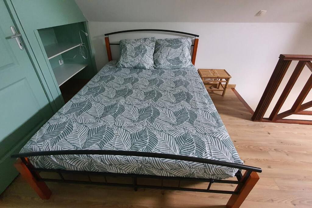 Postel nebo postele na pokoji v ubytování Les Clairs Matins