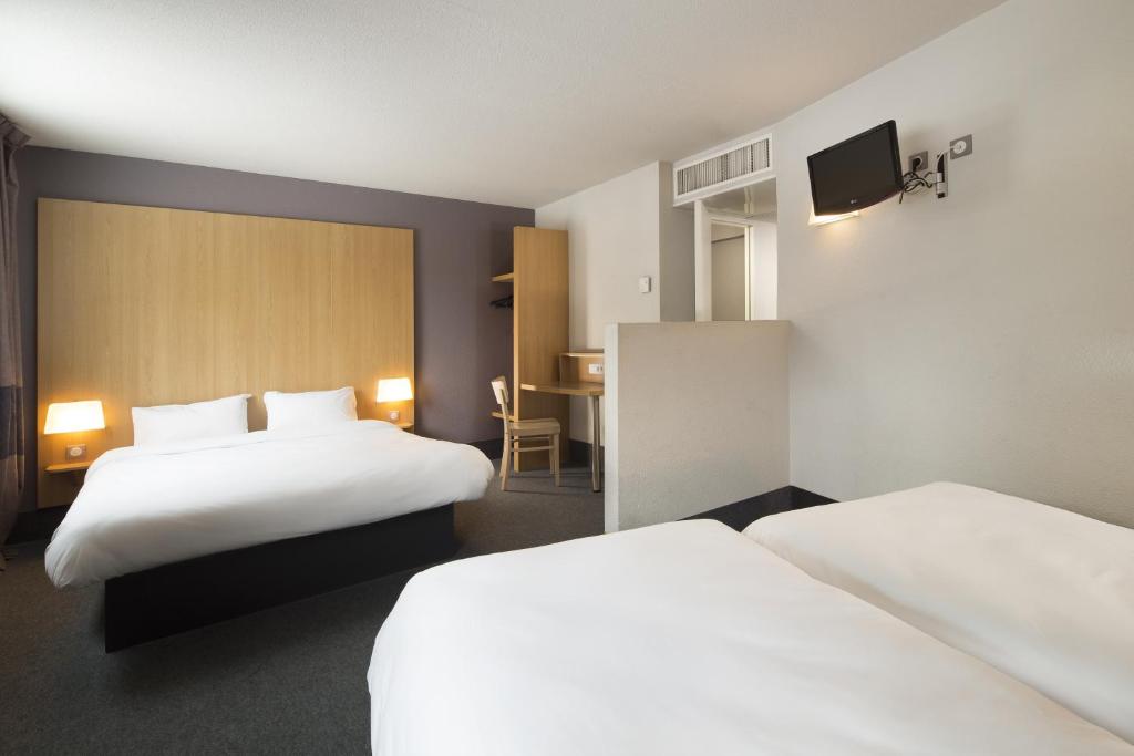 Postel nebo postele na pokoji v ubytování B&B HOTEL Montpellier Centre Le Millénaire