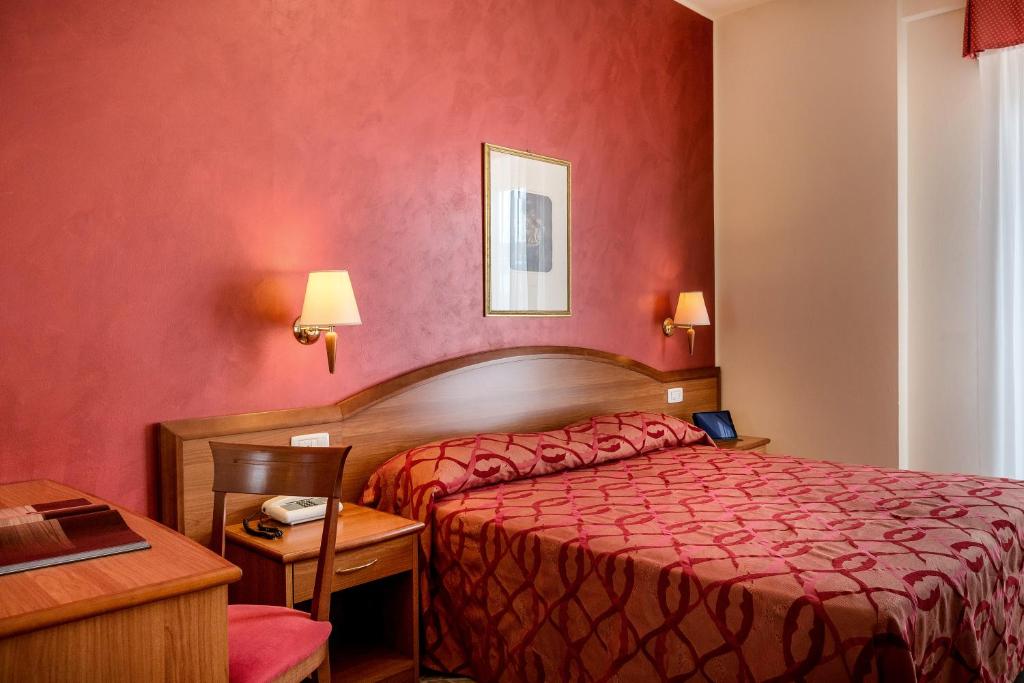 Postel nebo postele na pokoji v ubytování Hotel Tiffany