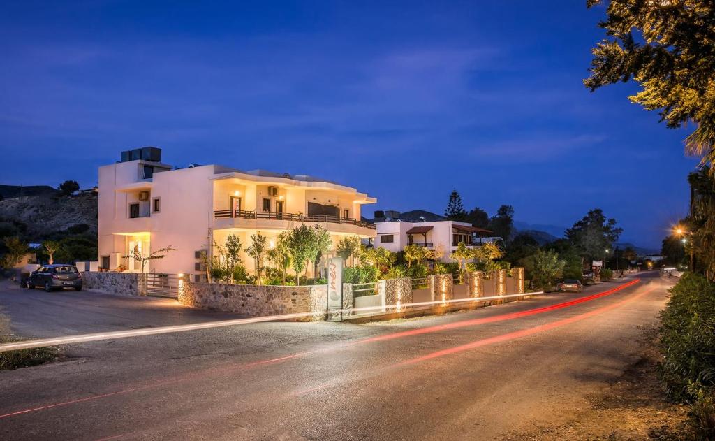 une maison sur le côté d'une route la nuit dans l'établissement Mear Luxury Holiday Homes - Cretan Sunny Gems, à Kountoura Selino