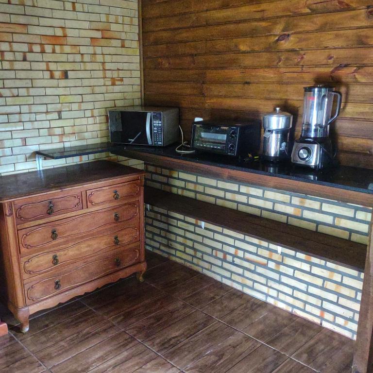 Kuchyň nebo kuchyňský kout v ubytování Alpes dos anjos casa mobiliada perto do centro canela rs