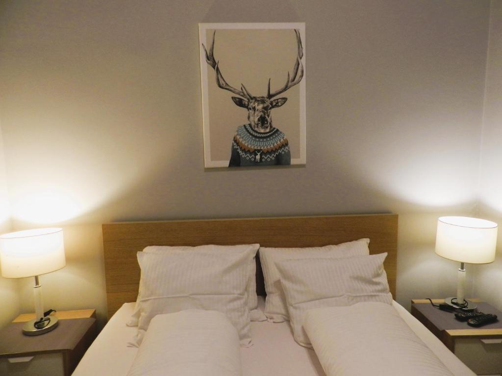 Posteľ alebo postele v izbe v ubytovaní Apartament Donnka